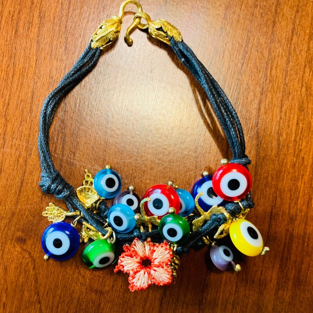 Black rope bracelet with chunky multiple colored glass evil eye & silver charms